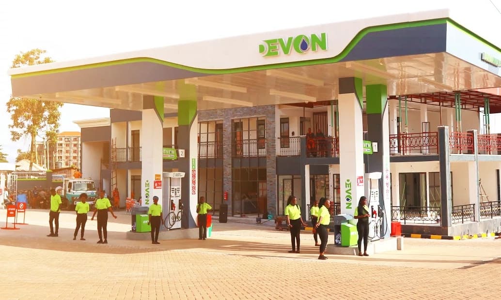 Attendants on the forecourt of a Devon Petroleum station